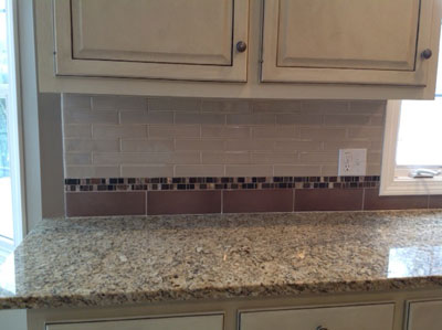 Cabinets, backsplash and countertop