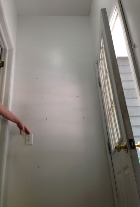 Bare wall at top of stairs