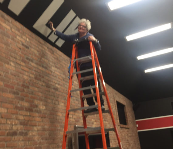 Sharon on Ladder at Gym