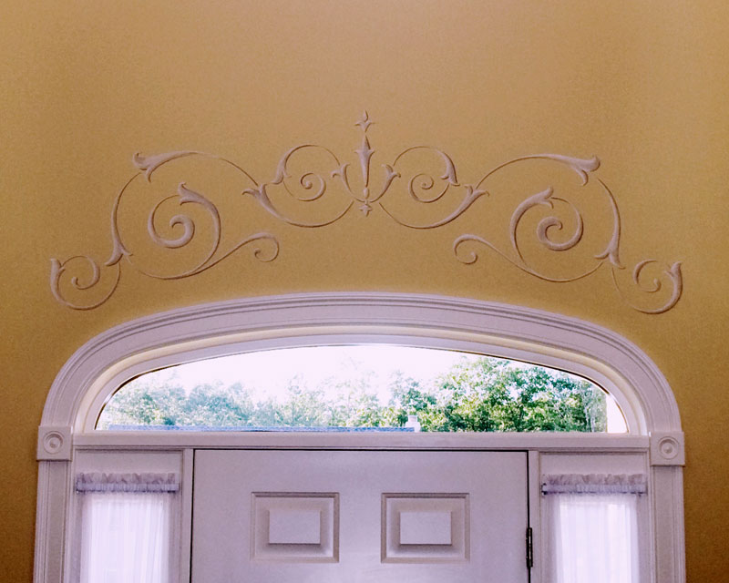 Traditional scrolled ornament over door