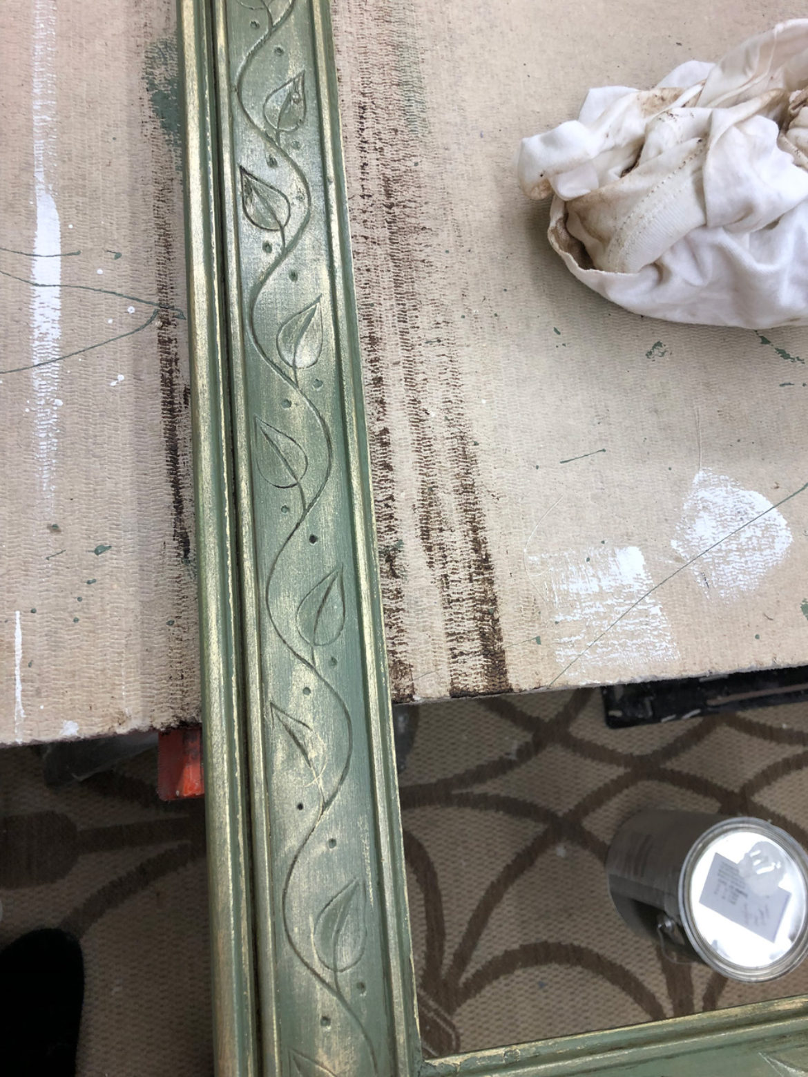 Molding painted green with wax and gold gilding