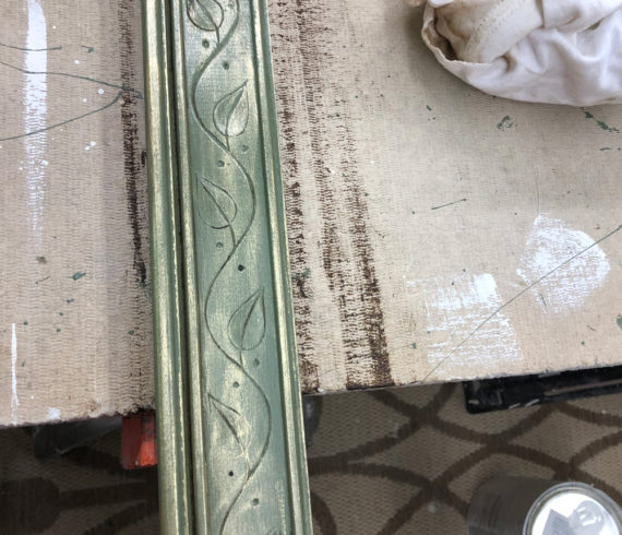 Molding painted green with wax and gold gilding