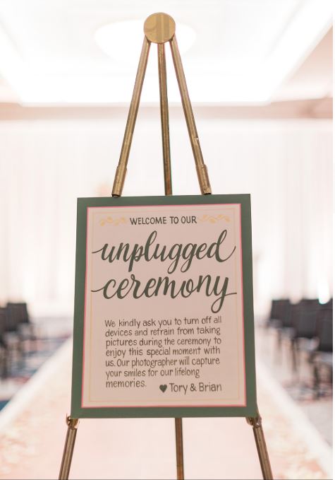 Unplugged sign at ceremony