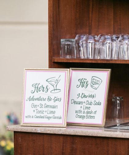 His and Hers cocktails signs on the bar