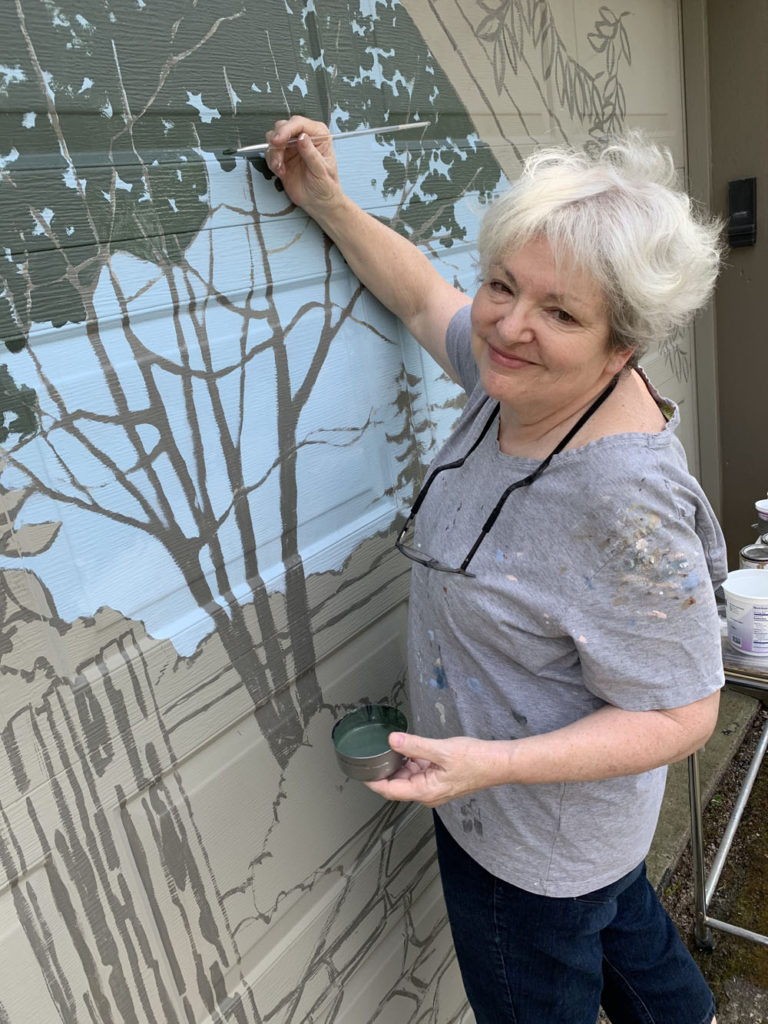 Sharon painting garage mural