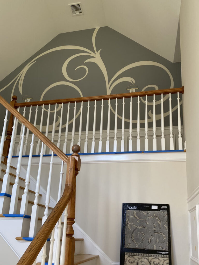 Scrollwork at top of the stairs