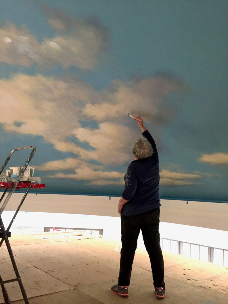 Painting the clouds while standing on the platform